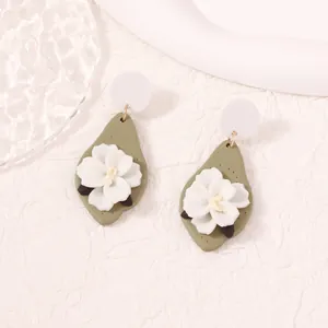 Handmade flower earrings with white petals and olive green teardrop polymer clay charms