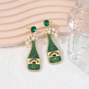 Green champagne bottle drop earrings with crown label and pearl bubbles design
