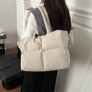 Chic beige quilted puffer tote bag with wide shoulder straps for daily leisure