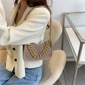 Minimalist felt baguette bag with gold chain and V-shaped quilting in khaki brown