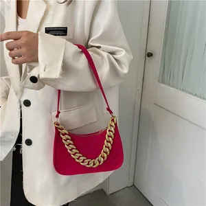 Hot pink felt baguette bag with quilted design and chunky gold chain strap for women