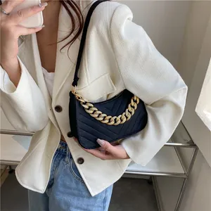 Fashionable black felt baguette bag with V-quilted texture and chunky gold chain strap