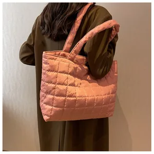 Detailed back view of pink quilted tote bag showing large capacity and padded shoulder strap