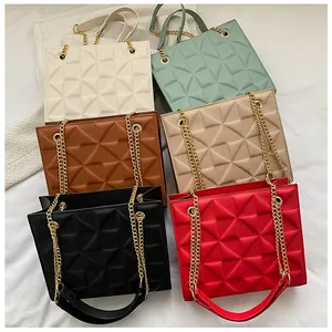 Matrix display of six colors for quilted tote bag featuring golden metal chain straps
