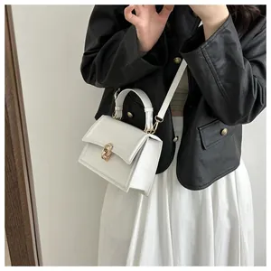 White structured PU leather crossbody bag with gold interlocking buckle and shoulder strap
