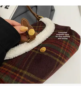 Detail of hidden magnetic buckle for easy open and close on vintage plaid wool bag