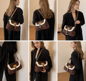 Detail showing vintage plaid shoulder bag with plush trim and brown leather strap