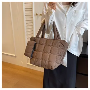 Detail of coffee brown quilted tote bag and matching detachable hanging coin purse
