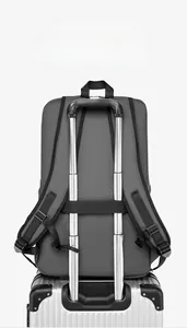 Waterproof business backpack with wide luggage strap attached to suitcase handle