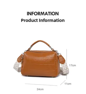 Detailed size view of a brown faux-crocodile texture shoulder bag with a woven strap