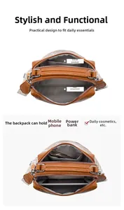 Detailed interior of brown crossbody bag showing main pocket and multiple compartments