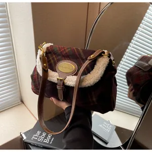 Close-up of retro plaid wool underarm bag with fuzzy lamb wool trim and metal detail