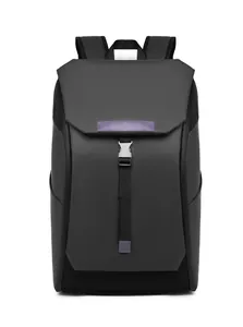 Detailed close-up of waterproof black backpack with metallic buckle and purple leather trim