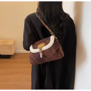 Retro plaid shoulder bag with white faux shearling trim and brown leather strap