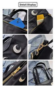 Details der schwarzen Nylon-Beuteltasche mit Augen-Stickerei und goldenen Beschlägen