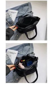 Schwarze Nylon-Beuteltasche Innenansicht mit viel Platz für Schirm und Handy