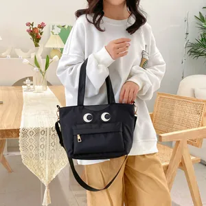 Damen Eimer Tasche in Schwarz mit großer Augenstickerei und verstellbarem Gurt
