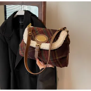 Detail of vintage plaid bag showing colorful tweed texture and white fuzzy faux fur trim