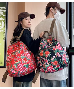 Detail of floral nylon backpacks with Chinese peony patterns and adjustable straps