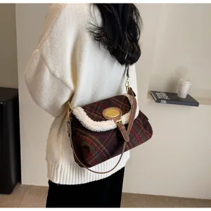 Detail of vintage plaid shoulder bag featuring brown tweed and white faux fur trim
