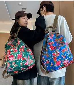 Close-up of floral pattern backpacks with high-density waterproof fabric and side pockets