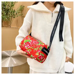 Close-up of the traditional Chinese peony floral print on a cylinder crossbody bag