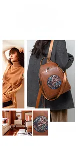 Detail of vintage brown leather backpack with artistic circular floral patch design