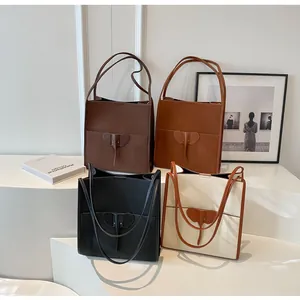 Detailed view of four leather tote bags featuring iconic elephant shaped leather patches