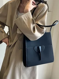 Minimalist black matte leather tote bag with unique elephant design patch for women
