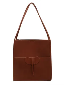 Deep brown matte leather tote bag with elephant leather patch and slender shoulder strap