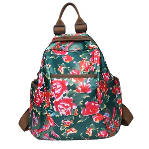 Ethnic style backpack with red floral patterns, main compartment and front pocket