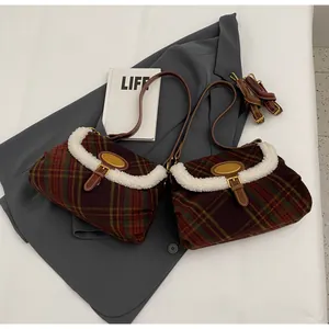 Close-up of retro plaid shoulder bags with fleece trim and adjustable brown leather straps