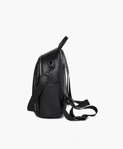Side view of black textured leather backpack with adjustable straps and side pocket