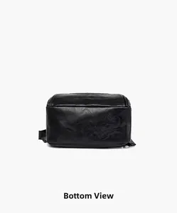 Detailed bottom view of large black leather backpack with neat stitching and smooth texture