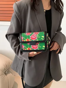 Chinese style green crossbody bag with red peony floral pattern and leather trim