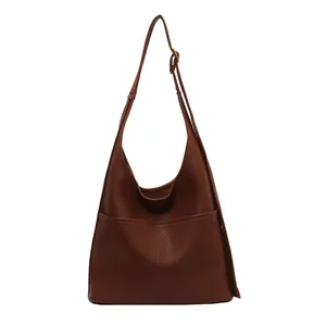 Brown leather large tote bag with lychee texture and adjustable strap for commuting