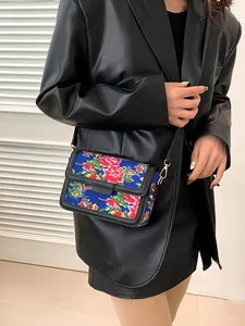 Ethnic style floral crossbody bag with vibrant peony patterns and golden hardware