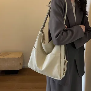 Large capacity creamy white leather tote bag with side pockets and golden hardware
