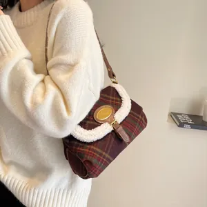Retro plaid shoulder bag with faux fur trim and adjustable brown leather strap on model