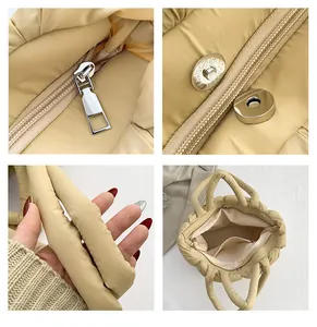 Detail view of quilted tote bag showing hardware, metal magnetic buckle, and interior lining