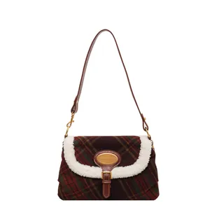 Retro red and green plaid shoulder bag with white faux fur trim and leather strap