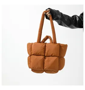Detail shot of the quilted padding and texture on this brown nylon tote bag