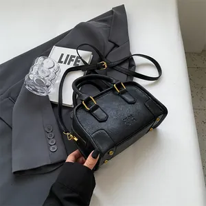 Classic black Boston bag with gold hardware and croc-textured leather for office style