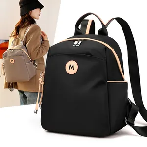 Lightweight black and brown nylon backpack with large capacity and M logo for women travel