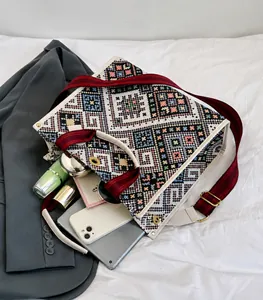 Detail view of large capacity ethnic tote bag showing organized interior storage space