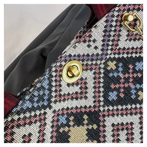 Macro shot of ethnic jacquard weaving texture and vintage gold metal twist lock