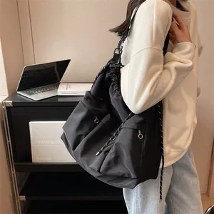 Minimalist black drawstring nylon crossbody bag with large capacity for women
