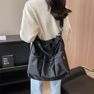 Women black large capacity utility crossbody bag with drawstring and multiple pockets