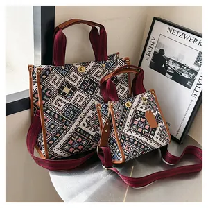 Close-up of bohemian style woven tote bags with colorful geometric ethnic patterns