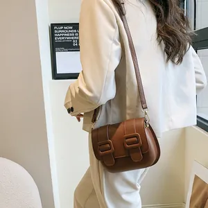 Retro brown crossbody saddle bag for women with matte leather and square buckle details
